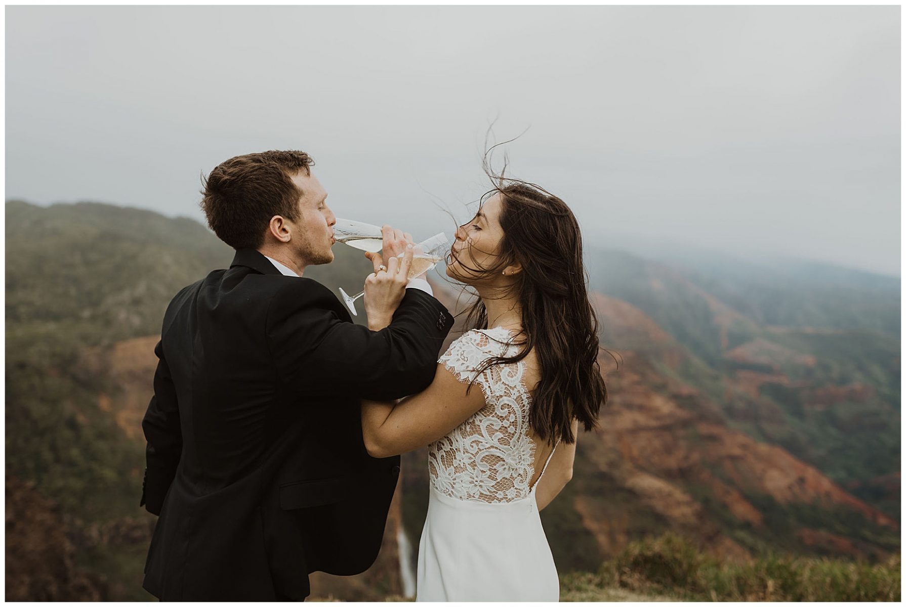 bride and groom sharing an intimate ceremony during their elopement on the cliffs of Waimea Canyon in Kauai, Hawaii 