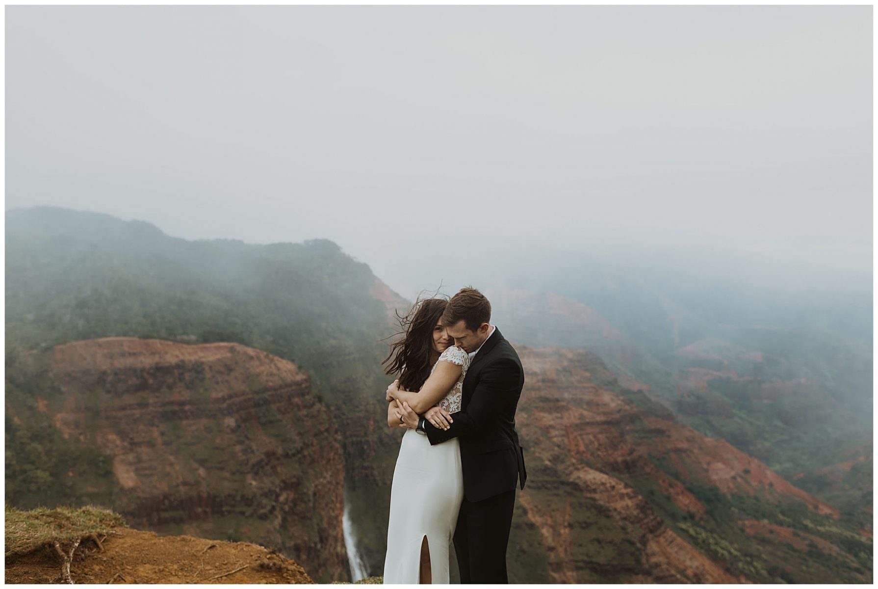 bride and groom sharing an intimate ceremony during their elopement on the cliffs of Waimea Canyon in Kauai, Hawaii 