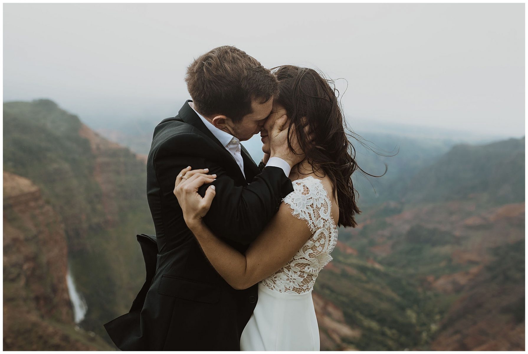 bride and groom sharing an intimate ceremony during their elopement on the cliffs of Waimea Canyon in Kauai, Hawaii 