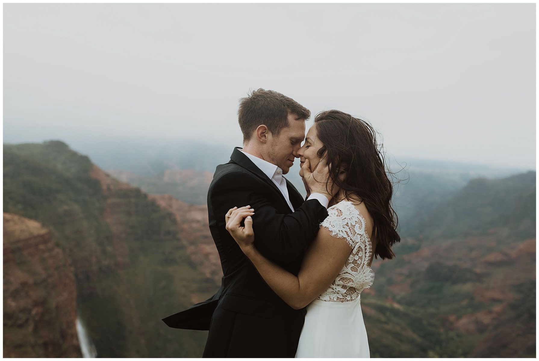 bride and groom sharing an intimate ceremony during their elopement on the cliffs of Waimea Canyon in Kauai, Hawaii 