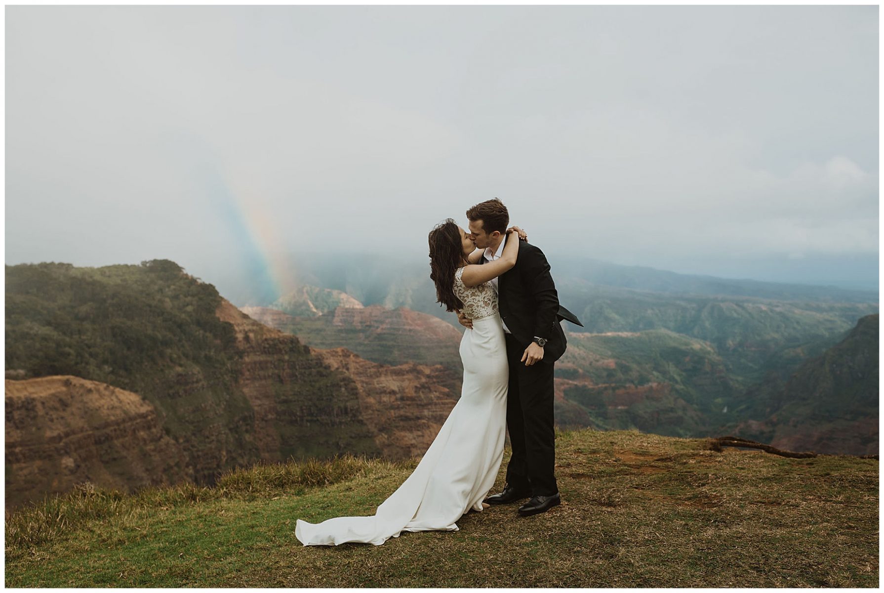 bride and groom exchanging vows during their elopement on the cliffs of Waimea Canyon in Kauai, Hawaii 