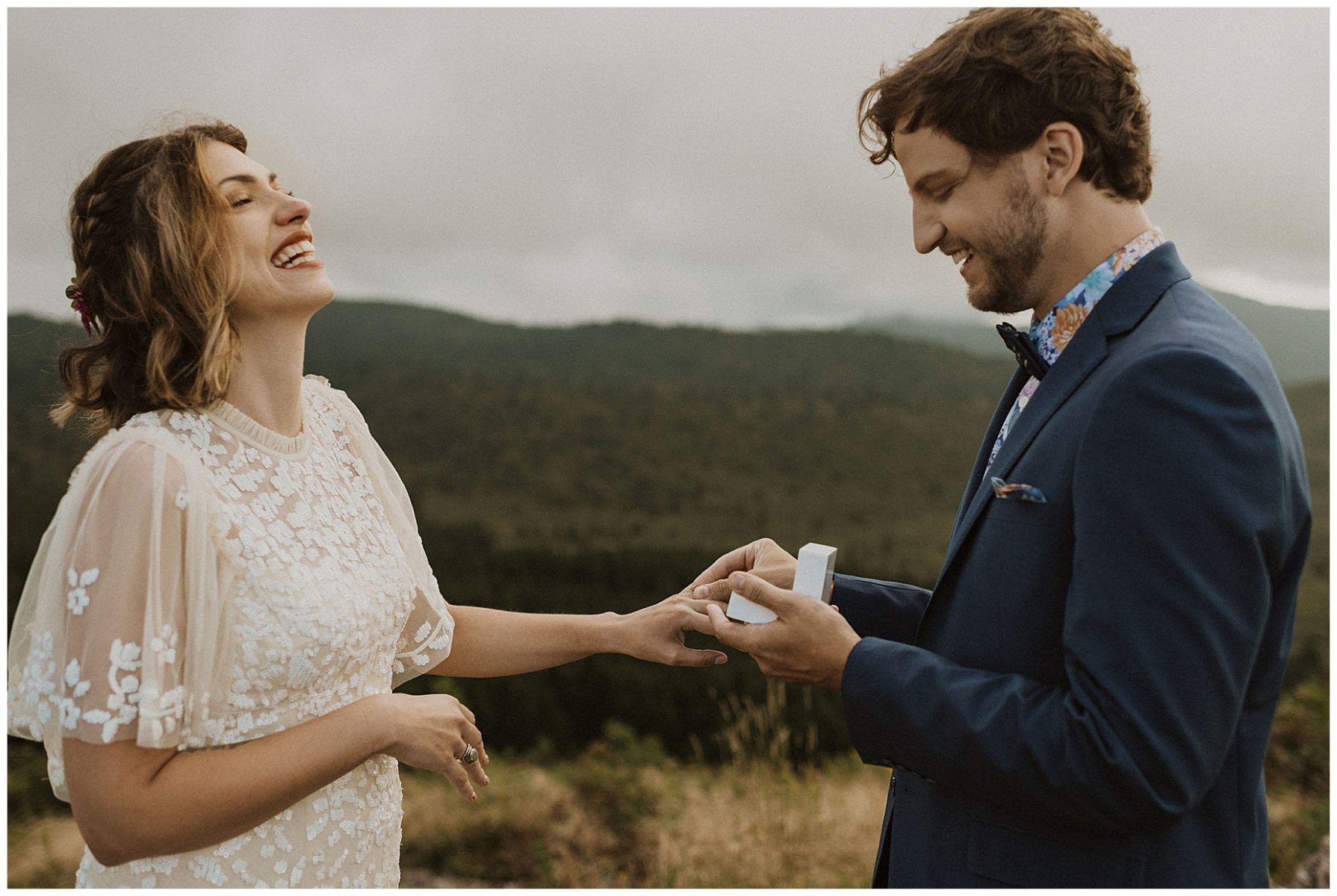 bride and groom exchanging vows on a mountaintop during their blue ridge mountains elopement